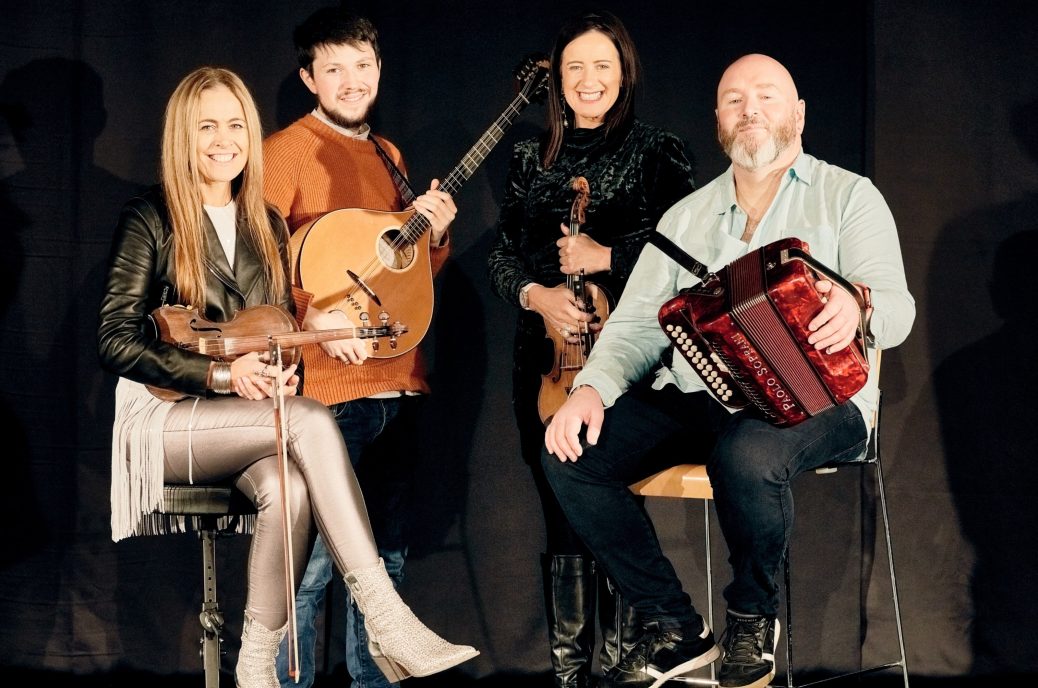 Photo of Derek Hicket Liz Yvonne Kane and Macdara Ó Faoláin against a plack background