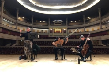 Anna Dennis Jonas Nordberg and Liam Byrne performing on stage